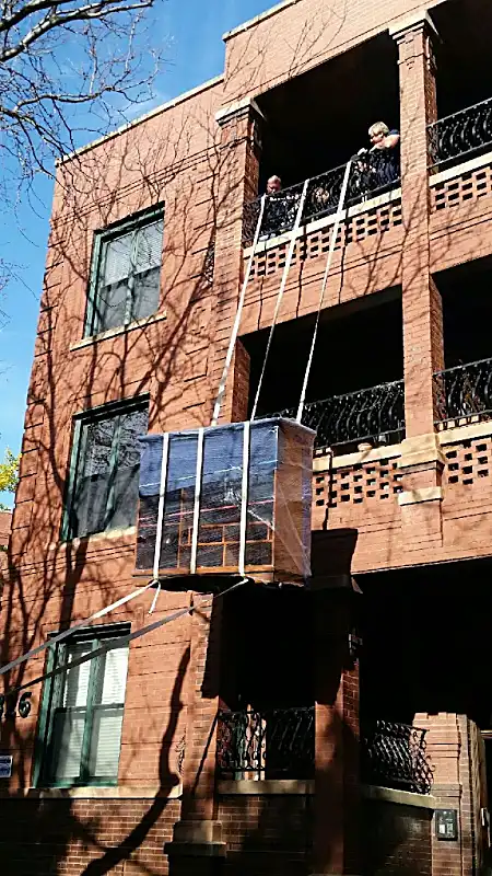 Moving equipment set up on a Chicago building exterior